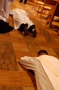 The community prays over the ordinandi as they lie prostrate before the Lord.