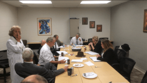 The cast, gathering between acts