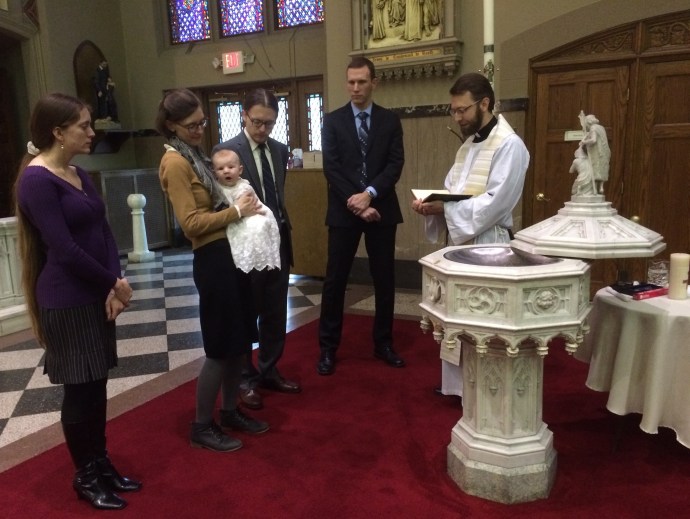 Alert in his mother's arms...Francis awaits the waters of rebirth